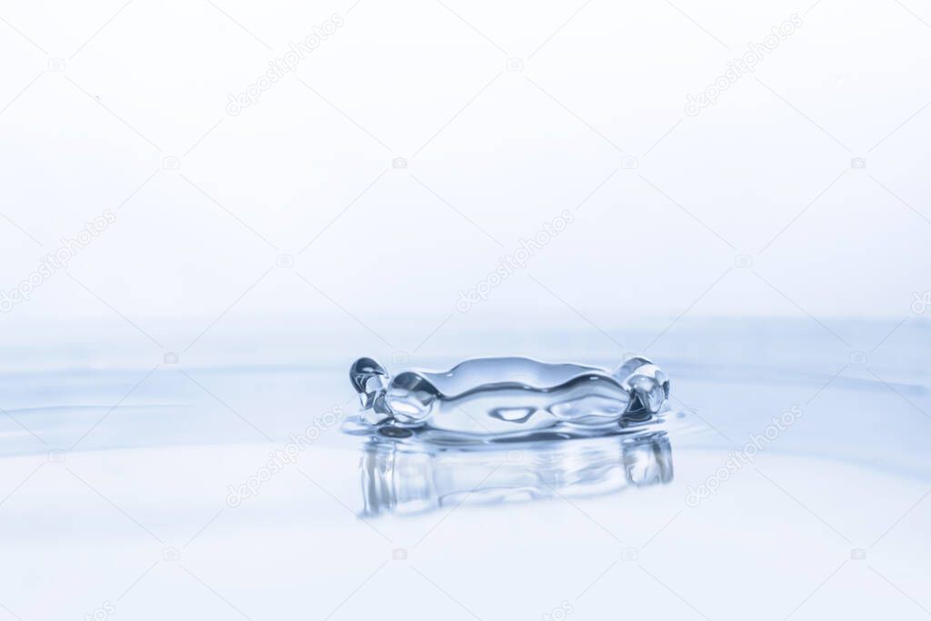 Water drop on water background