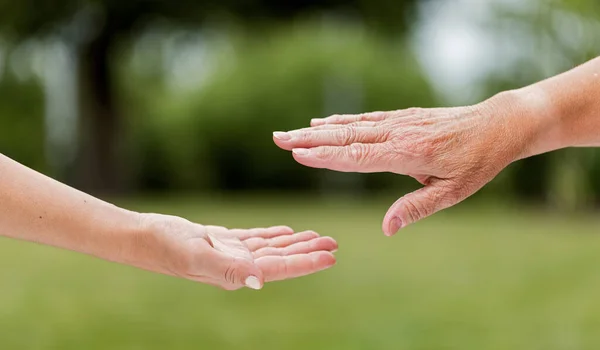 Helping Hands Elderly Home Care Outdoors Royalty Free Stock Images