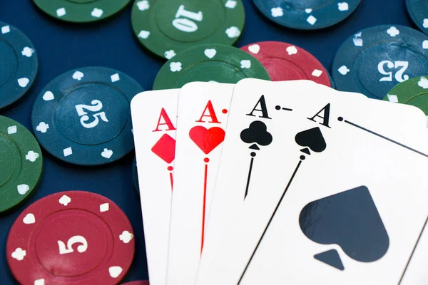 Four aces and chips, card game, cards on the table. Poker and blackjack, play cards.