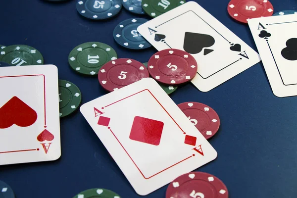 Four aces and chips, card game, cards on the table. Poker and blackjack, play cards.