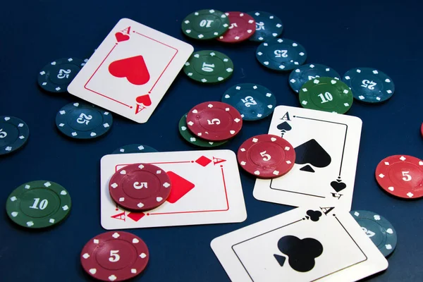 Four aces and chips, card game, cards on the table. Poker and blackjack, play cards.