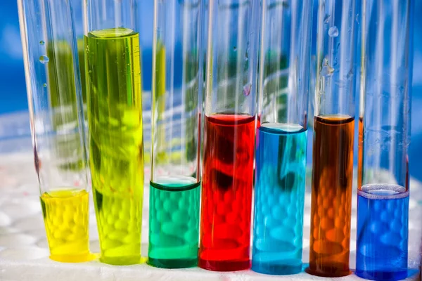 Laboratory instruments, glassware and reagents, colorful liquid chemical elements, research diagnoses