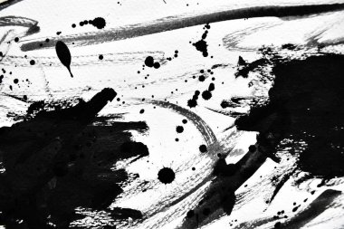 Beyaz kağıda siyah mürekkep damlacıkları