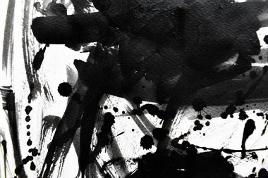 Arka plan siyaha boyanır. Mürekkep ve suluboya sanatından yaratıcı soyut sanat.