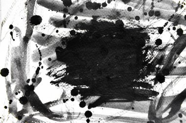 Arka plan siyaha boyanır. Mürekkep ve suluboya sanatından yaratıcı soyut sanat.