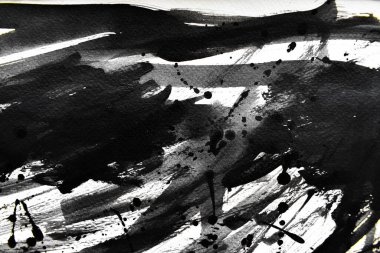 Arka plan siyaha boyanır. Mürekkep ve suluboya sanatından yaratıcı soyut sanat.