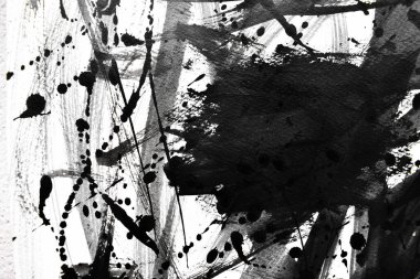 Arka plan siyaha boyanır. Mürekkep ve suluboya sanatından yaratıcı soyut sanat.