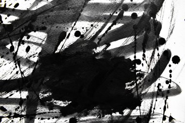 Arka plan siyaha boyanır. Mürekkep ve suluboya sanatından yaratıcı soyut sanat.