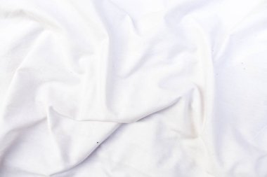 Soyut beyaz kumaş dokusu arkaplanı. Dalgalı beyaz kumaş.