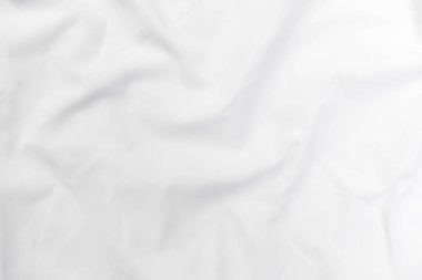 Soyut beyaz kumaş dokusu arkaplanı. Dalgalı beyaz kumaş.