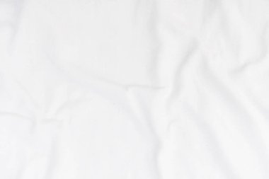 Soyut beyaz kumaş dokusu arkaplanı. Dalgalı beyaz kumaş.