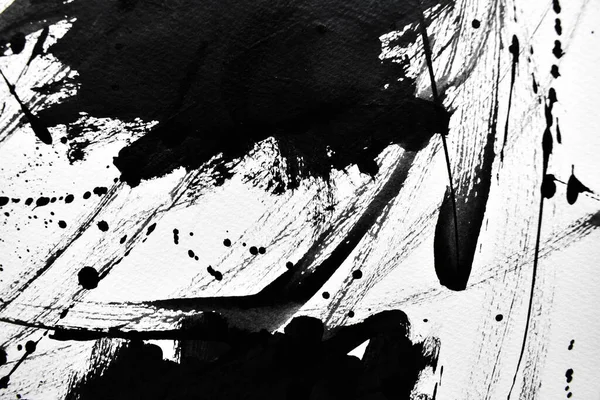 Beyaz kağıda siyah mürekkep damlacıkları