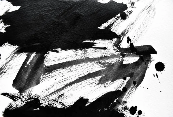 Beyaz kağıda siyah mürekkep damlacıkları