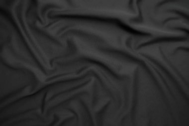 Arkaplan dokusu siyah kumaş. Soyut koyu dalgalı yumuşak. Kumaş kırışmış. Lüks moda tarzı..