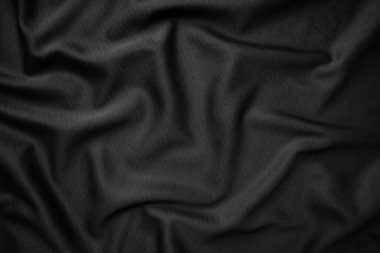 Arkaplan dokusu siyah kumaş. Soyut koyu dalgalı yumuşak. Kumaş kırışmış. Lüks moda tarzı..