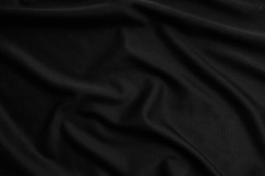 Arkaplan dokusu siyah kumaş. Soyut koyu dalgalı yumuşak. Kumaş kırışmış. Lüks moda tarzı..