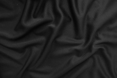Arkaplan dokusu siyah kumaş. Soyut koyu dalgalı yumuşak. Kumaş kırışmış. Lüks moda tarzı..
