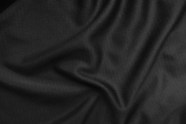 Arkaplan dokusu siyah kumaş. Soyut koyu dalgalı yumuşak. Kumaş kırışmış. Lüks moda tarzı..