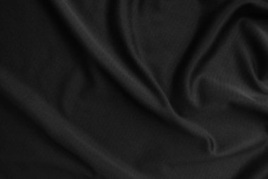 Arkaplan dokusu siyah kumaş. Soyut koyu dalgalı yumuşak. Kumaş kırışmış. Lüks moda tarzı..