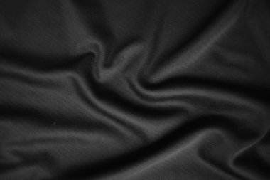 Arkaplan dokusu siyah kumaş. Soyut koyu dalgalı yumuşak. Kumaş kırışmış. Lüks moda tarzı..