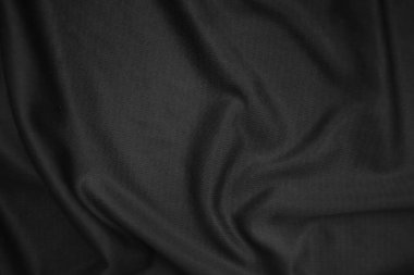 Arkaplan dokusu siyah kumaş. Soyut koyu dalgalı yumuşak. Kumaş kırışmış. Lüks moda tarzı..