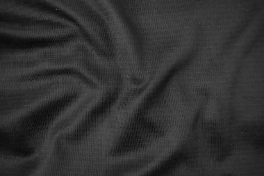 Arkaplan dokusu siyah kumaş. Soyut koyu dalgalı yumuşak. Kumaş kırışmış. Lüks moda tarzı..