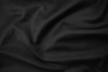 Arkaplan dokusu siyah kumaş. Soyut koyu dalgalı yumuşak. Kumaş kırışmış. Lüks moda tarzı..