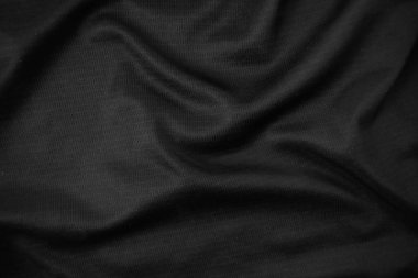 Arkaplan dokusu siyah kumaş. Soyut koyu dalgalı yumuşak. Kumaş kırışmış. Lüks moda tarzı..
