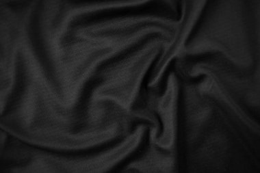 Arkaplan dokusu siyah kumaş. Soyut koyu dalgalı yumuşak. Kumaş kırışmış. Lüks moda tarzı..