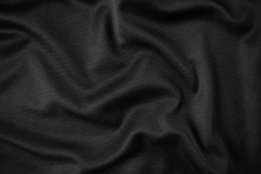 Arkaplan dokusu siyah kumaş. Soyut koyu dalgalı yumuşak. Kumaş kırışmış. Lüks moda tarzı..