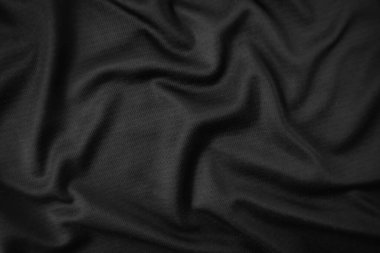 Arkaplan dokusu siyah kumaş. Soyut koyu dalgalı yumuşak. Kumaş kırışmış. Lüks moda tarzı..