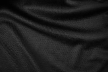 Arkaplan dokusu siyah kumaş. Soyut koyu dalgalı yumuşak. Kumaş kırışmış. Lüks moda tarzı..