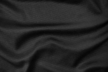 Arkaplan dokusu siyah kumaş. Soyut koyu dalgalı yumuşak. Kumaş kırışmış. Lüks moda tarzı..