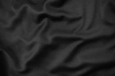 Arkaplan dokusu siyah kumaş. Soyut koyu dalgalı yumuşak. Kumaş kırışmış. Lüks moda tarzı..