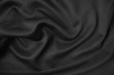 Arkaplan dokusu siyah kumaş. Soyut koyu dalgalı yumuşak. Kumaş kırışmış. Lüks moda tarzı..