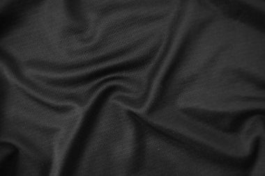 Arkaplan dokusu siyah kumaş. Soyut koyu dalgalı yumuşak. Kumaş kırışmış. Lüks moda tarzı..
