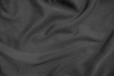 Arkaplan dokusu siyah kumaş. Soyut koyu dalgalı yumuşak. Kumaş kırışmış. Lüks moda tarzı..