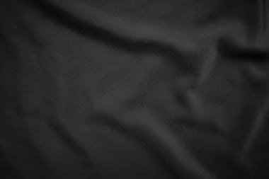 Arkaplan dokusu siyah kumaş. Soyut koyu dalgalı yumuşak. Kumaş kırışmış. Lüks moda tarzı..