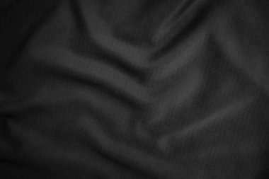 Arkaplan dokusu siyah kumaş. Soyut koyu dalgalı yumuşak. Kumaş kırışmış. Lüks moda tarzı..