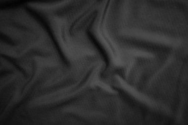 Arkaplan dokusu siyah kumaş. Soyut koyu dalgalı yumuşak. Kumaş kırışmış. Lüks moda tarzı..