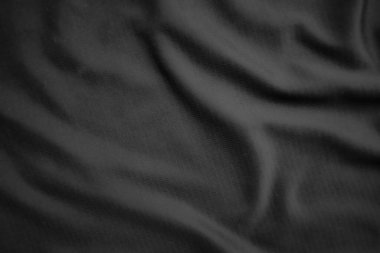 Arkaplan dokusu siyah kumaş. Soyut koyu dalgalı yumuşak. Kumaş kırışmış. Lüks moda tarzı..