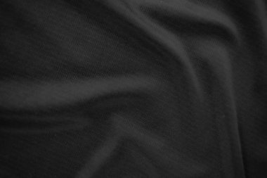 Arkaplan dokusu siyah kumaş. Soyut koyu dalgalı yumuşak. Kumaş kırışmış. Lüks moda tarzı..