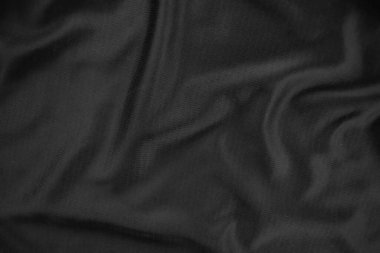 Arkaplan dokusu siyah kumaş. Soyut koyu dalgalı yumuşak. Kumaş kırışmış. Lüks moda tarzı..