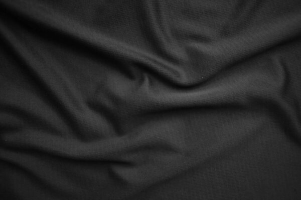 Текстура фона черная ткань. Абстрактно темный, мягкий. Ткань морщинистая. Стиль роскоши
.