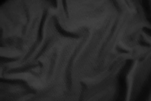 Background texture black cloth. Abstract dark wavy soft. Fabric is wrinkled. Fashion luxury style.