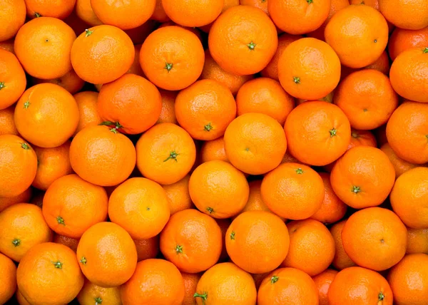 Fresh mandarin oranges texture. Background orange fruit.