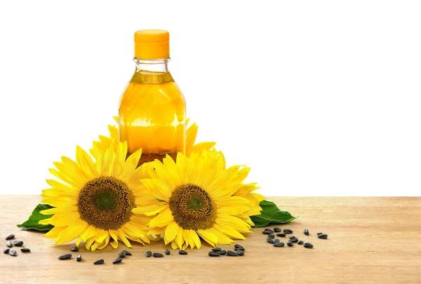 Eine Flasche Sonnenblumenöl Mit Blumen Und Sonnenblumenkernen Auf Dem Holztisch — Stockfoto