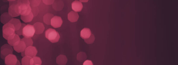 dark mauve background with blurry pink bokeh lights, wide banner backdrop