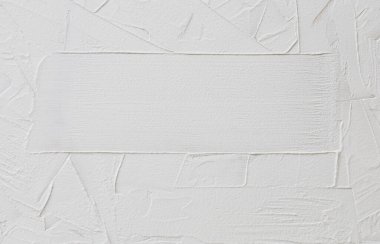 Düzensiz çizgiler ve vuruşlar ve metin için yer ile macun veya alçıtaşının beyaz soyut arkaplanı