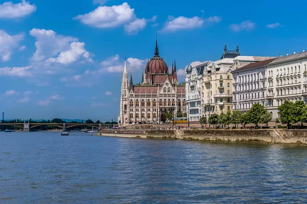 A view of the east bank of the River Danube in Budapest from a boat on the river during summertime